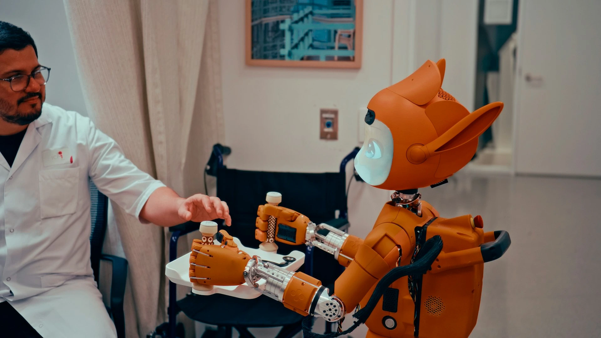 Man gives robot bottles on a tray